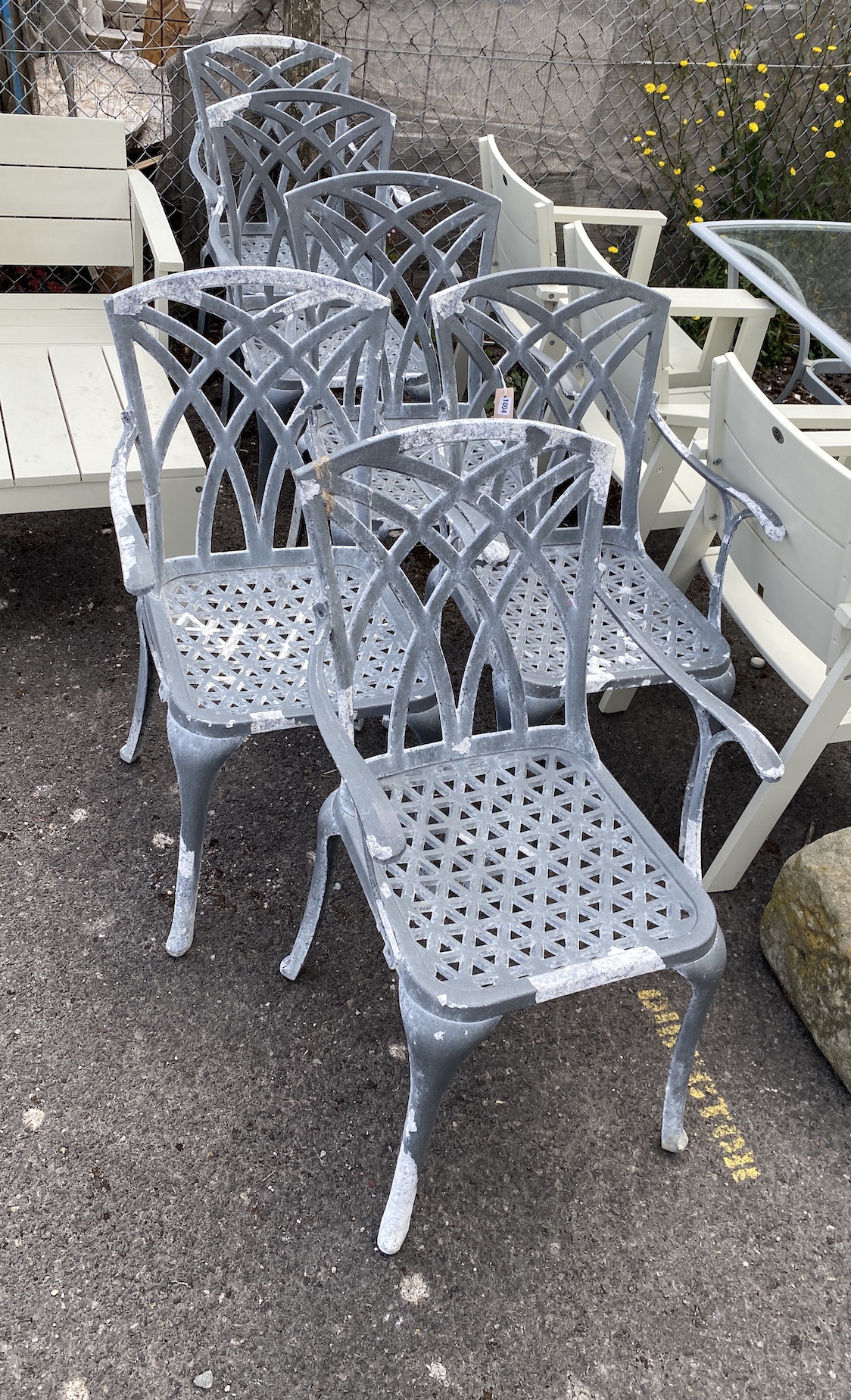 A set of six aluminium garden elbow chairs